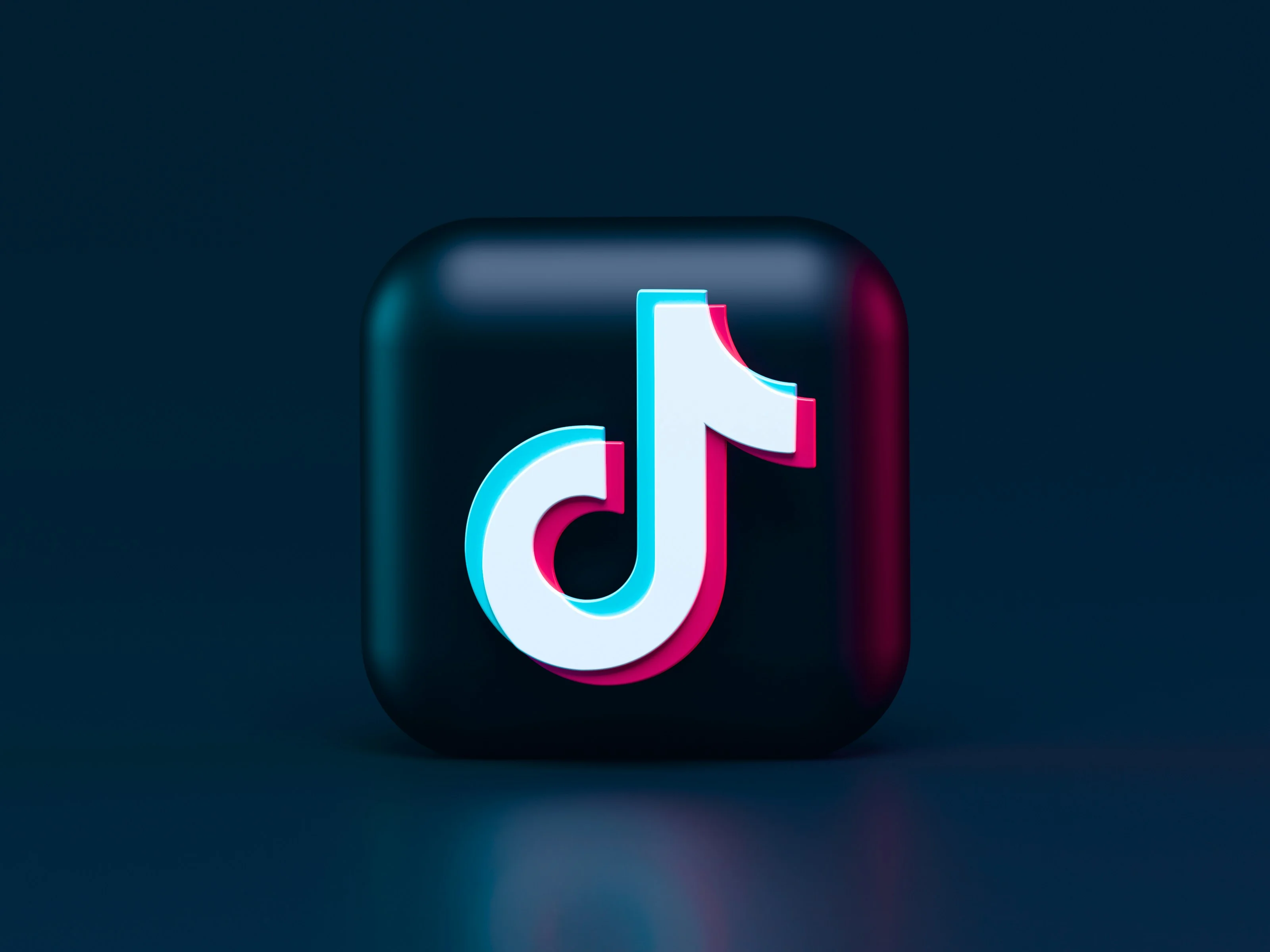 Stylized TikTok logo on a dark background